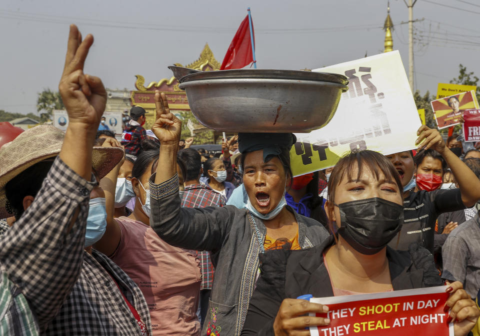 FILE - In this Feb. 18, 2021, file photo, demonstrators protest against the military junta's arrest of National League for Democracy party lawmakers Aung Myay Thar Zan Township court in Mandalay, Myanmar. The military takeover of Myanmar early in the morning of Feb. 1 reversed the country's slow climb toward democracy after five decades of army rule. But Myanmar's citizens were not shy about demanding their democracy be restored. (AP Photo, File)