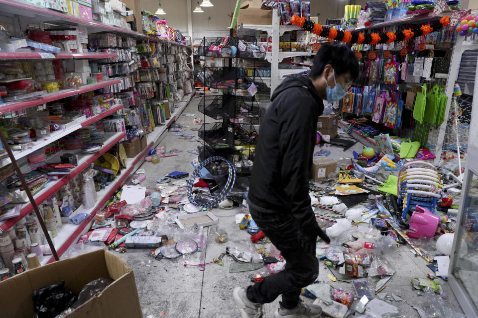 A worker cleans up a supermarket looted during protests in Santiago, Chile, Sunday, Oct. 20, 2019. Chilean President SebastiÃ¡n PiÃ±era on Saturday announced the suspension of a subway fare hike that had prompted violent student protests, less than a day after he declared a state of emergency amid rioting and commuter chaos in the capital. (Photo: Esteban Felix/AP)