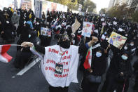 Demonstrators chant slogans in a rally in front of the former U.S. Embassy commemorating the anniversary of its 1979 seizure in Tehran, Iran, Thursday, Nov. 4, 2021. The embassy takeover triggered a 444-day hostage crisis and break in diplomatic relations that continues to this day. (AP Photo/Vahid Salemi)