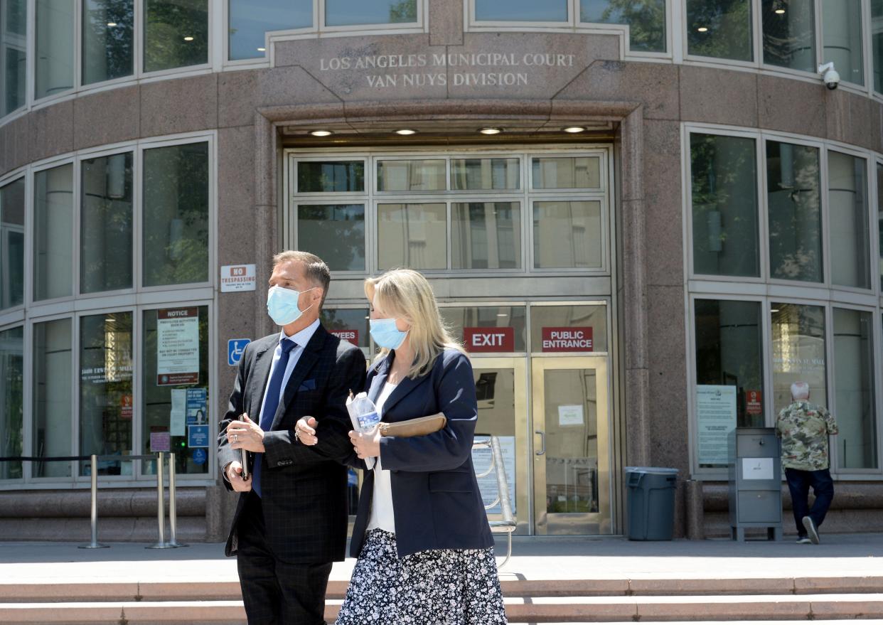 Rebecca Grossman, right, walks out of a Van Nuys courthouse on in May 2022.