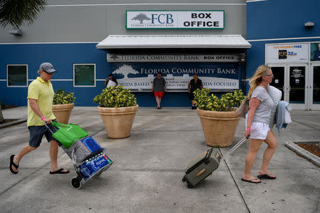 Residents of the surrounding communities arrive at the Germain Arena to seek shelter in preparation for Hurricane Irma in Estero, Florida, U.S., September 9, 2017. REUTERS/Bryan Woolston