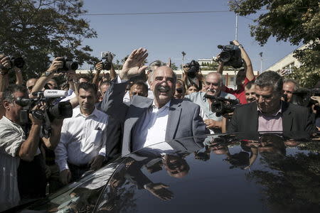 Conservative New Democracy leader Vangelis Meimarakis waves at party supporters after voting for the general election at a polling station in Athens, Greece, September 20, 2015. REUTERS/John Liakos/Intimenews