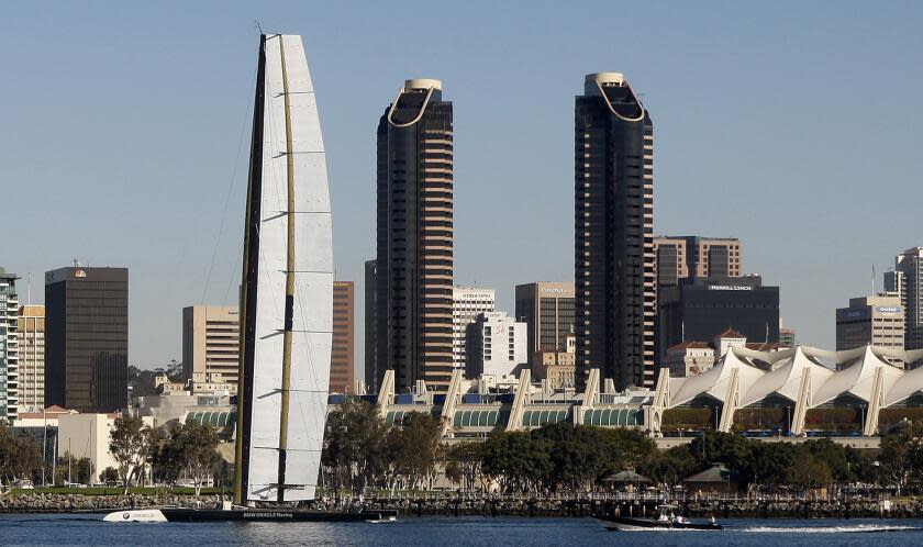 ** ADVANCE FOR WEEKEND EDITIONS, FEB. 6-7 ** In this photo taken on Wednesday, Nov. 25, 2009, The BMW Oracle trimaran sails past the San Diego skyline during testing in San Diego. The trimaran, with it's 190 foot fixed wing sail, races against America's Cup defending champion, Alinghi of Switzerland, beginning Monday in Spain. (AP Photo/Lenny Ignelzi)