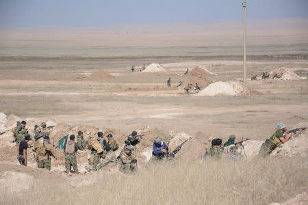 Popular Mobilization Forces (PMF) take part during a battle with Islamic State militants, west of Mosul,Iraq February 22, 2017. REUTERS/Stringer