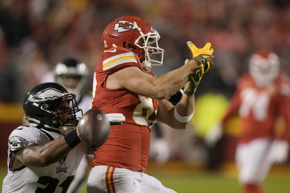 Kansas City Chiefs tight end Travis Kelce, right, is unable to catch a pass as Philadelphia Eagles safety Kevin Byard (31) defends during the first half of an NFL football game, Monday, Nov. 20, 2023, in Kansas City, Mo. (AP Photo/Charlie Riedel)