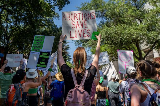 PHOTO: Abortion rights activists and supporters march outside of the Austin Convention Center where the American Freedom Tour with former President Donald Trump is being held on May 14, 2022, in Austin, Texas.  (Brandon Bell/Getty Images)
