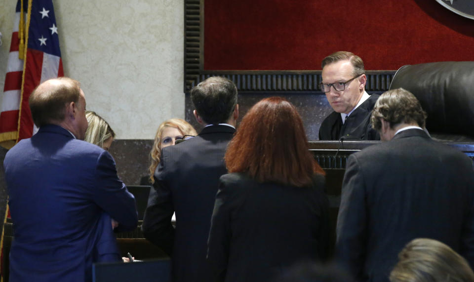 Judge Thad Balkman speaks with attorneys during the opioid trial Monday, June 24, 2019 in Norman, Okla. (AP Photo/Sue Ogrocki, Pool)