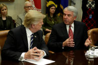 Robert Hugin (R), Executive Chairman of Celgene Corporation, talks to U.S. President Donald Trump at a meeting with Pharma industry representatives at the White House in Washington, U.S., January 31, 2017. REUTERS/Yuri Gripas