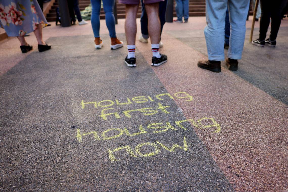 Chalk messages are left on the steps of the Nakamura Federal Courthouse during a rally Monday.