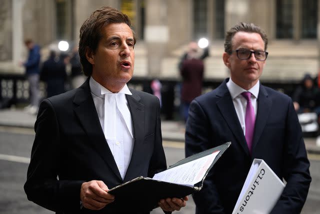 <p>Leon Neal/Getty Images</p> David Sherbourne reads a written statement on behalf of his legal client Prince Harry following the ruling in his favor in a lawsuit against the Mirror Group on December 15.