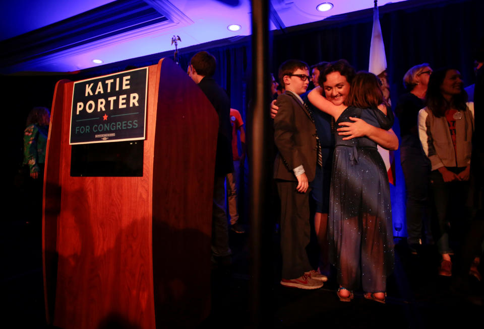 Democratic congressional candidate Katie Porter hugs her children at the end of her midterm election night party in Irvine, California, U.S. November 6, 2018. REUTERS/Kyle Grillot