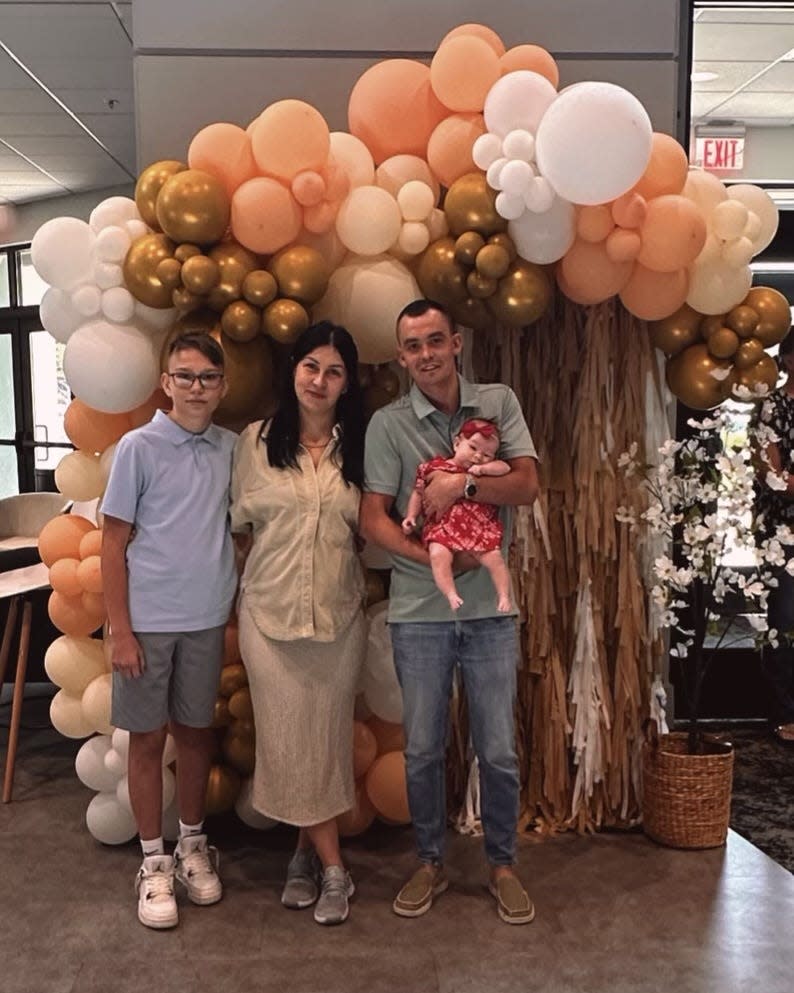 Olena Zinchenko and Oleh Lonov with their son Rostyslav Zinchenko and their daughter who was born in Macon, Miss. after the family moved there in May 2023.