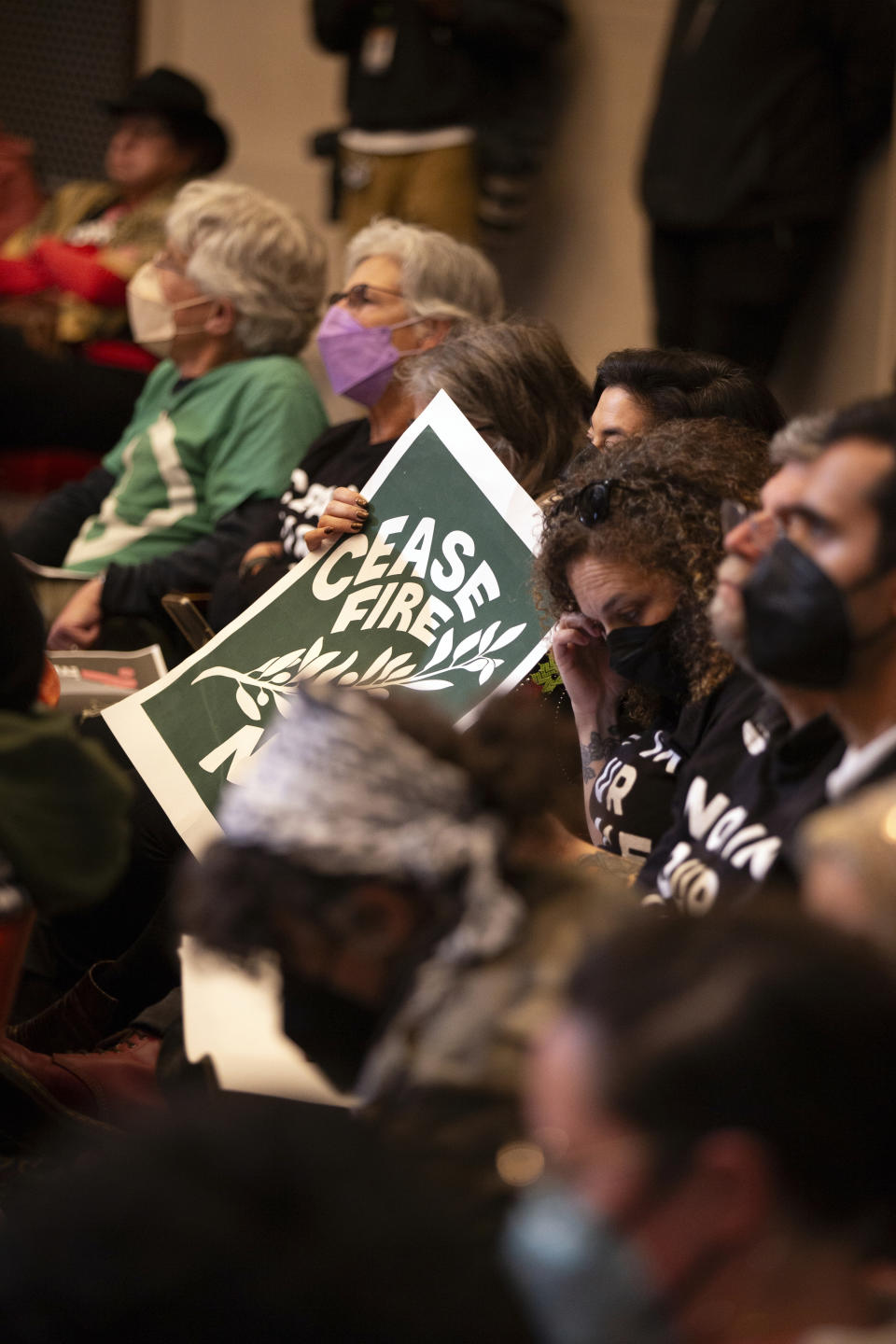 Audience members listen to public comment at a special session of the Oakland City Council about a resolution calling for an immediate ceasefire in Gaza, Monday, Nov. 27, 2023, in Oakland, Calif. (AP Photo/D. Ross Cameron)