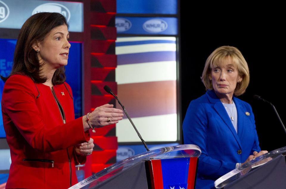 Sen. Kelly Ayotte, R-N.H., left, speaks as and Democratic challenger Gov. Maggie Hassan listens during a televised debate in Manchester, N.H. on Nov. 2, 2016.(Photo: Jim Cole, Pool)