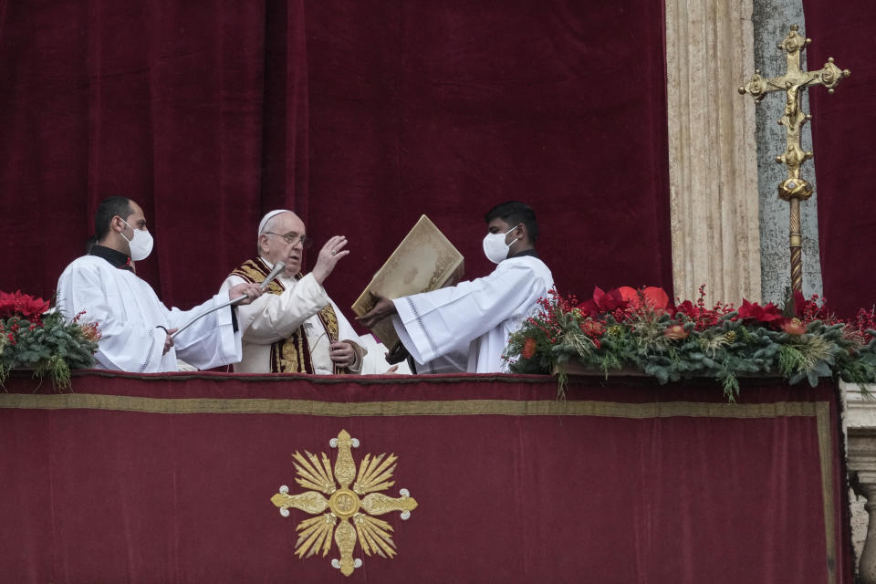 Pope Francis delivers the Urbi et Orbi (Latin for 'to the city and to the world' ) Christmas' day blessing from the main balcony of St. Peter's Basilica at the Vatican, Saturday, Dec. 25, 2021. (AP Photo/Gregorio Borgia)