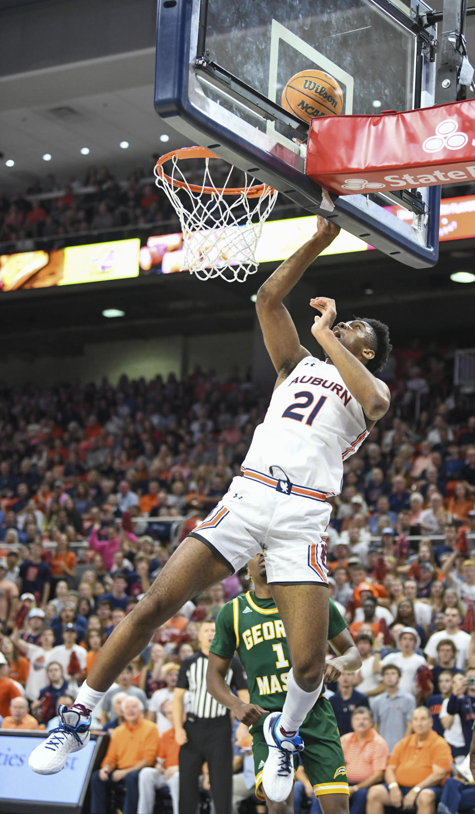 Auburn forward Yohan Traore (21) scores two points during the first half of an NCAA college basketball game against George Mason, Monday, Nov. 7, 2022, in Auburn, Ala. (AP Photo/Julie Bennett)