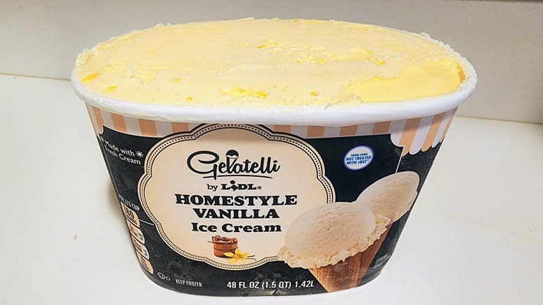 Open carton of vanilla ice cream