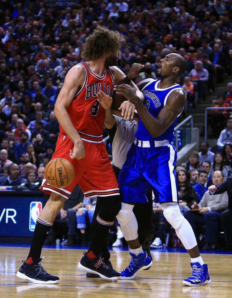 <p>Robin Lopez #8 of the Chicago Bulls fights with Serge Ibaka #9 of the Toronto Raptors during the second half of an NBA game at Air Canada Centre on March 21, 2017 in Toronto, Canada. NOTE TO USER: User expressly acknowledges and agrees that, by downloading and or using this photograph, User is consenting to the terms and conditions of the Getty Images License Agreement. (Photo by Vaughn Ridley/Getty Images) </p>