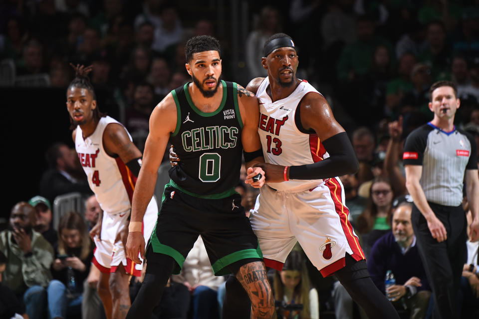 BOSTON, MA - MAY 1: Jayson Tatum #0 of the Boston Celtics and Bam Adebayo #13 of the Miami Heat plays defense during the game during Round 1 Game 5 of the 2024 NBA Playoffs on May 1, 2024 at the TD Garden in Boston, Massachusetts. NOTE TO USER: User expressly acknowledges and agrees that, by downloading and or using this photograph, User is consenting to the terms and conditions of the Getty Images License Agreement. Mandatory Copyright Notice: Copyright 2024 NBAE  (Photo by Brian Babineau/NBAE via Getty Images)