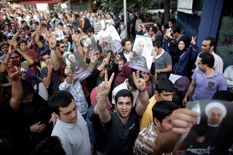 Iranian supporters of moderate presidential candidate Hassan Rouhani who won the national elections, celebrate in downtown Tehran on June 15, 2013. (BEHROUZ MEHRI/AFP/Getty Images)