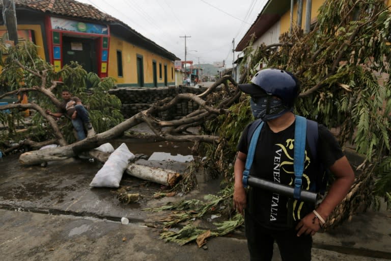 Anti-government demonstrators guard an improvised barricade in the town of Masaya, 35 km from Managua on June 5, 2018