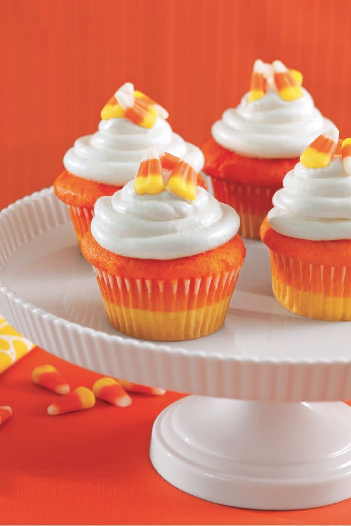 <p>Use food dye to make your cupcakes look like everyone's favorite Halloween candy. </p><p><a href="https://www.womansday.com/food-recipes/food-drinks/a28835151/candy-corn-cupcakes-recipe/" rel="nofollow noopener" target="_blank" data-ylk="slk:Get the Candy Corn Cupcakes recipe.;elm:context_link;itc:0;sec:content-canvas" class="link "><strong><em>Get the Candy Corn Cupcakes recipe. </em></strong> </a></p>