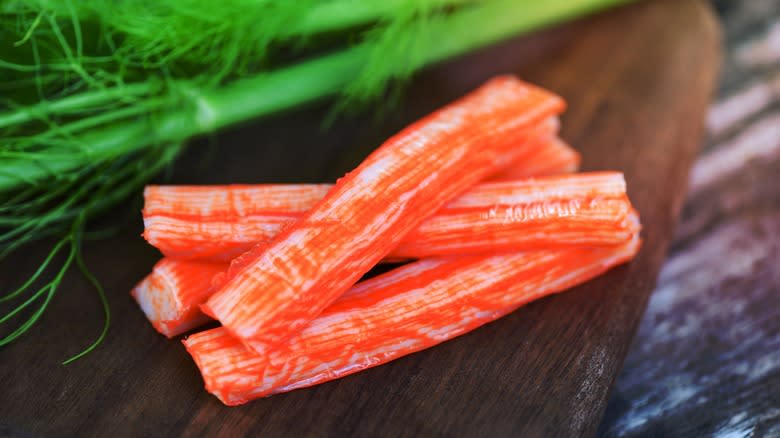 crab sticks on wooden cutting board