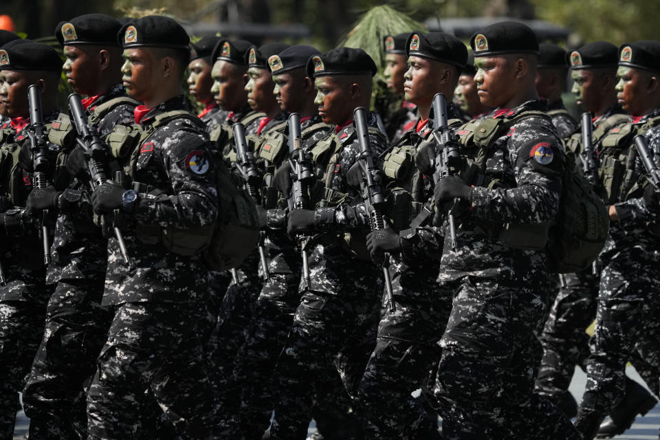 Filipino troopers march during rites at the 126th founding anniversary of the Philippine Army at Fort Bonifacio in Taguig, Philippines on Wednesday, March 22, 2023. (AP Photo/Aaron Favila)