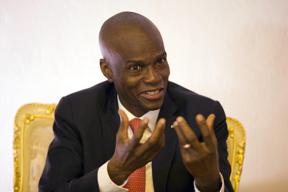 Haiti's President Jovenel Moise speaks during an interview in his office in Port-au-Prince, Haiti, Wednesday, Aug. 28, 2019. Moise told The Associated Press Wednesday that he will serve out his term despite rising violence, poor economic performance and months of protests over unresolved allegations of corruption in his predecessor’s administration. (AP Photo/Dieu Nalio Chery)