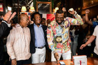 Former Boston Red Sox player David Ortiz, right, celebrates his election to the baseball hall of fame with his father Leo Ortiz, left, and MLB Hall of Fame player Pedro Martinez, center, at the moment of receiving the news in Santo Domingo, Dominican Republic, Tuesday, Jan. 25, 2022. (AP Photo/Manolito Jimenez)