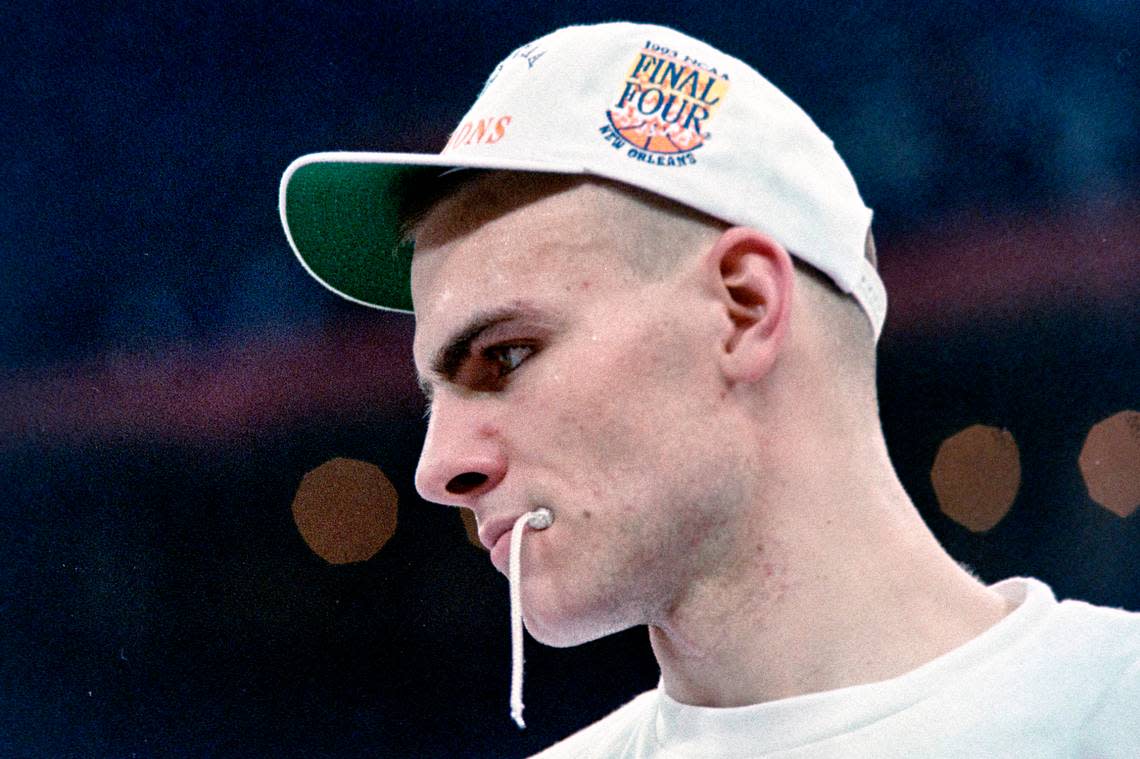 UNC center Eric Montross bites on a piece of the victory nets during postgame ceremonies after the Tar Heels defeated Michigan to win the 1993 NCAA Championship in New Orleans.