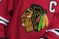 FILE - The Chicago Blackhawks' logo is seen during an NHL hockey game on Jan. 19, 2023, in Philadelphia. The Blackhawks will not wear Pride-themed warmup jerseys before Sunday's March 26, 2023, Pride Night game against Vancouver because of security concerns involving a Russian law that expands restrictions on activities seen as promoting LGBTQ rights in the country. (AP Photo/Matt Slocum, File)