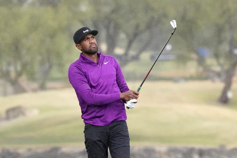 Tony Finau watches his approach shot from the 18th fairway during the third round of The American Express golf tournament on the Pete Dye Stadium Course at PGA West, Saturday, Jan. 23, 2021, in La Quinta, Calif. (AP Photo/Marcio Jose Sanchez)