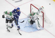 Dallas Stars goaltender Anton Khudobin (35) makes a save as Tampa Bay Lightning's Anthony Cirelli (71) and Stars' Esa Lindell (23) battle in front during second-period NHL Stanley Cup finals hockey action in Edmonton, Alberta, Saturday, Sept. 19, 2020. (Jason Franson/The Canadian Press via AP)