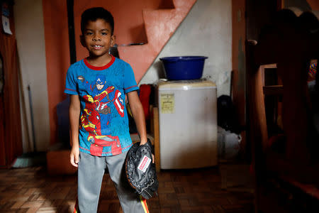 Jesus Cordova (7), poses for a picture in his house in Caracas, Venezuela August 29, 2017. REUTERS/Carlos Garcia Rawlins/Files