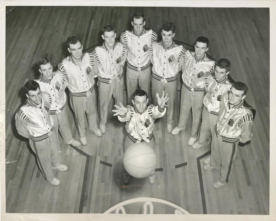 With Gene &quot;Squeaky&quot; Melchiorre taking a shot, the 1949-50 Bradley Braves basketball team poses for an Associated Press photo. On the date of the photo — Feb. 22, 1950 — the team was ranked No. 1 in the nation. From left to right are Mike Chianakas, Fred Schlictman, Dave Humerickhouse, Aaron Preece, Elmer Behnke, Jim Kelly, Paul Unruh, Billy Mann and Charles &quot;Bud&quot; Grover.