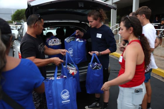 Volunteers with King’s Cathedral Maui help unload a donation of supplies on Aug. 10, 2023 in Kahului, Hawaii.<span class="copyright">Justin Sullivan—Getty Images</span>