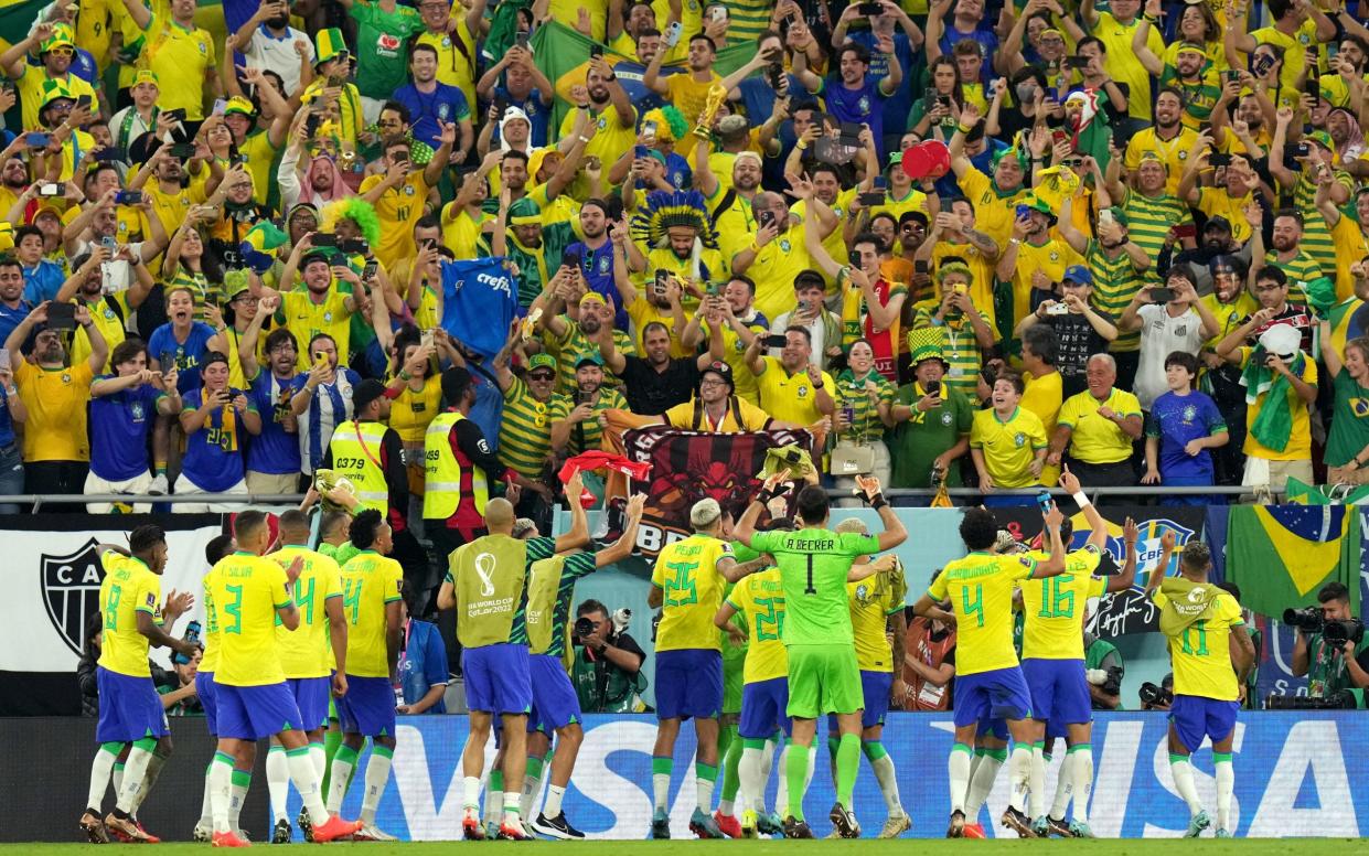 Brazil players celebrate with fans/Brazil World Cup 2022 squad list, fixtures and latest odds - PA/JONATHAN BRADY