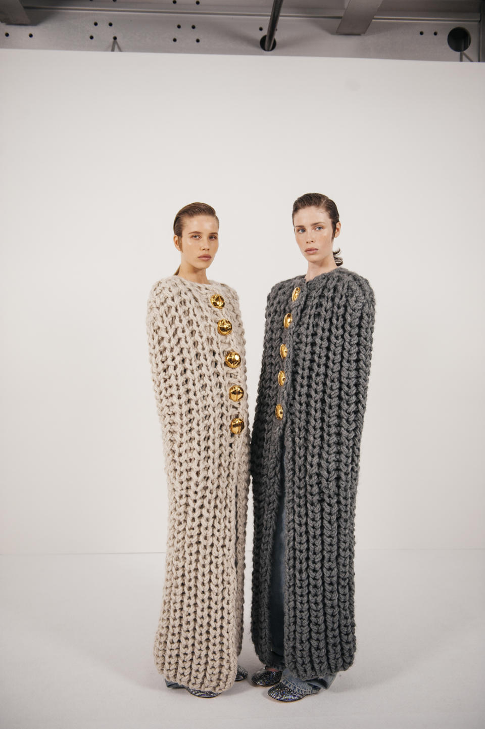 Backstage at Loewe Ready To Wear Spring 2024 held at Esplanade Saint Louis on September 29, 2023 in Paris, France. Models wearing long, knit capes.