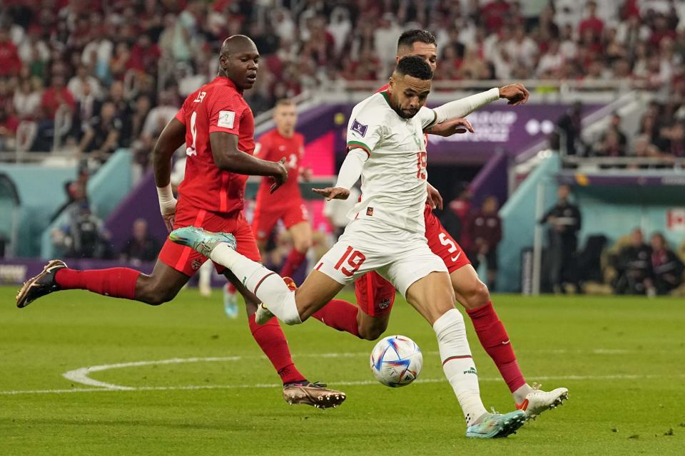 Morocco's Youssef En-Nesyri scores his side's second goal during the World Cup group F soccer match between Canada and Morocco at the Al Thumama Stadium in Doha , Qatar, Thursday, Dec. 1, 2022. (AP Photo/Pavel Golovkin)