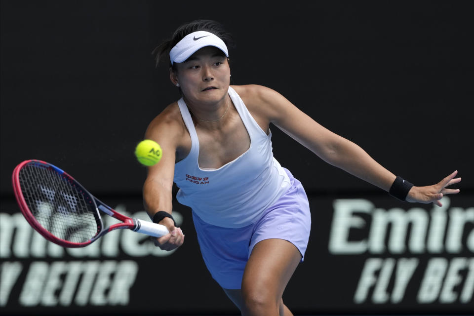 Wang Yafan of China plays a forehand return to compatriot Zheng Qinwen during their third round match at the Australian Open tennis championships at Melbourne Park, Melbourne, Australia, Saturday, Jan. 20, 2024. (AP Photo/Andy Wong)