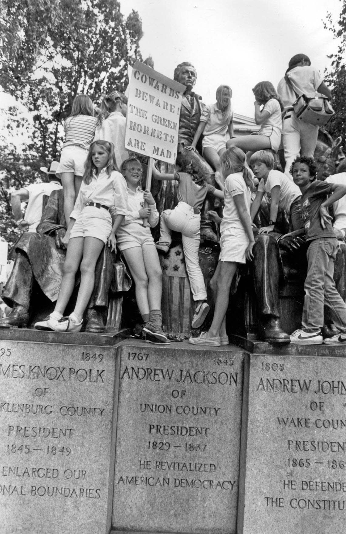 Supporters of the Equal Rights Amendment climb on the statue of Andrew Jackson on the grounds of the State Capitol in Raleigh, June 8, 1982.