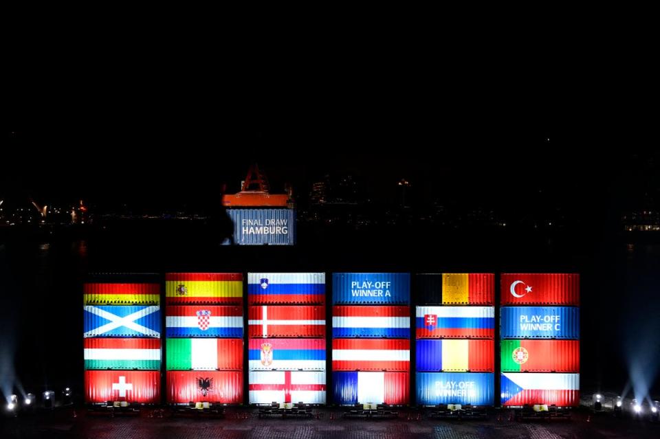 Port workers in Hamburg stack containers with flags of the Euro 2024 teams in accordance with the draw (REUTERS)