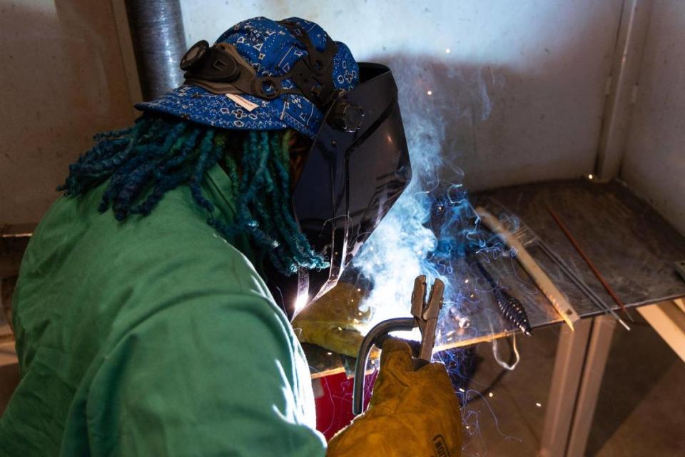 Treasure Brewster practices welding at Midlands Technical College on Tuesday, March 5, 2024. Brewster started the welding program in January, and hopes to add this skill to her wide-ranging professional and artistic skill set.
