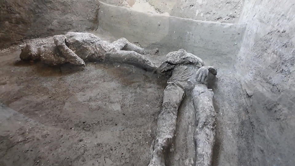 The remains of two who perished in the volcanic eruption that buried Pompeii.  / Credit: CBS News