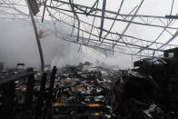 Smoke rises from a burned warehouse, Friday, June 5, 2020, in Redlands, Calif. The fire destroyed the Southern California distribution facility that was used to ship items to Amazon customers but authorities said employees got out and there were no reports of injuries. (AP Photo/Jae C. Hong)