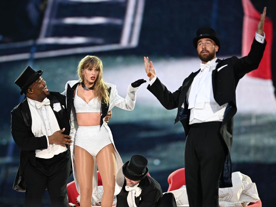 Taylor Swift is joined onstage by Travis Kelce (R), during "Taylor Swift | The Eras Tour" at Wembley Stadium on June 23, 2024 in London, England.