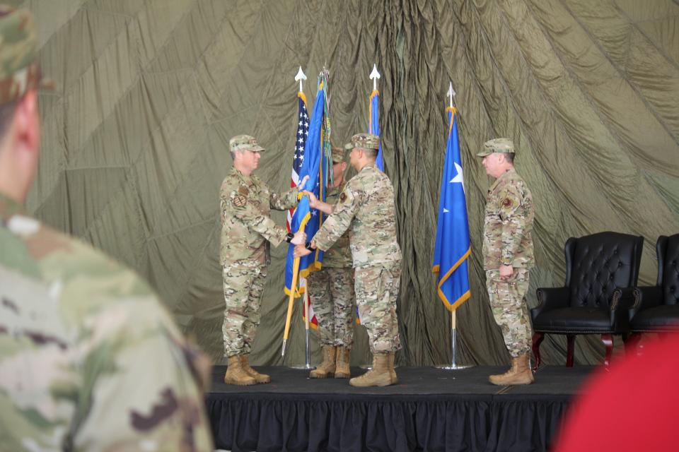 Lt. Gen. Michael E. Conley gives to Col. Robert L. Johnston command of the U.S. Air Force 27th Special Operations Wing as outgoing commander Col. Jeremy S. Bergin looks on during a change of command ceremony Monday, July 15, 2024 at Cannon Air Force Base, N.M.