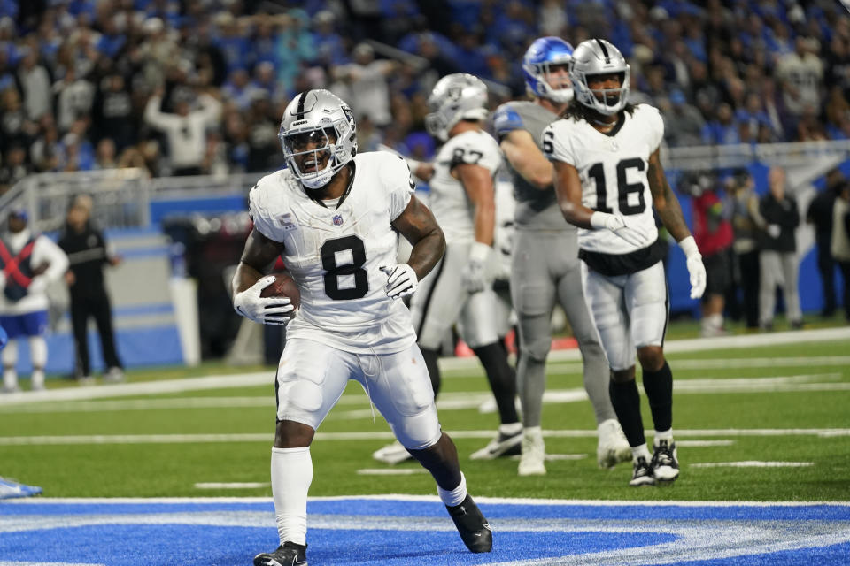 Las Vegas Raiders running back Josh Jacobs (8) reacts after his three-yard rushing touchdown during the first half of an NFL football game against the Detroit Lions, Monday, Oct. 30, 2023, in Detroit. (AP Photo/Paul Sancya)