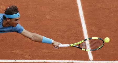 Rafael Nadal of Spain returns returns the ball. REUTERS/Gonzalo Fuentes